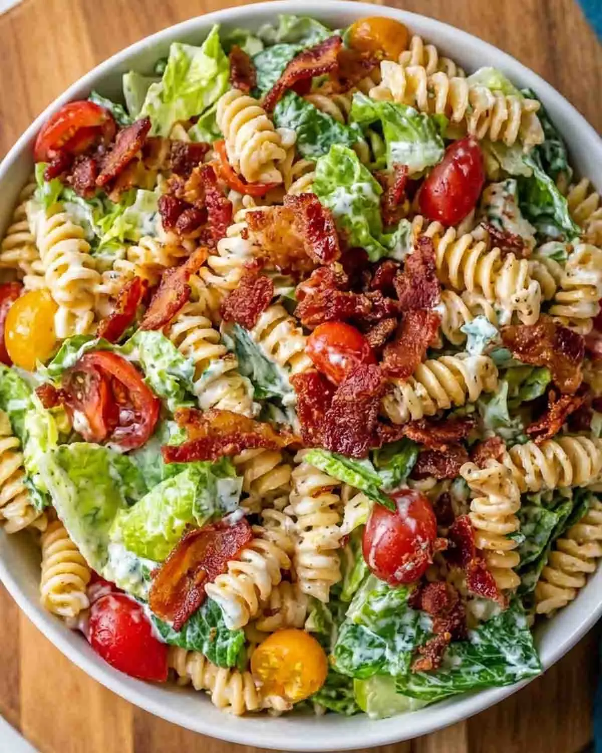 BLT Pasta Salad Recipe 3 creamy BLT pasta salad with crispy bacon, rotini pasta, lettuce, and cherry tomatoes in a bowl