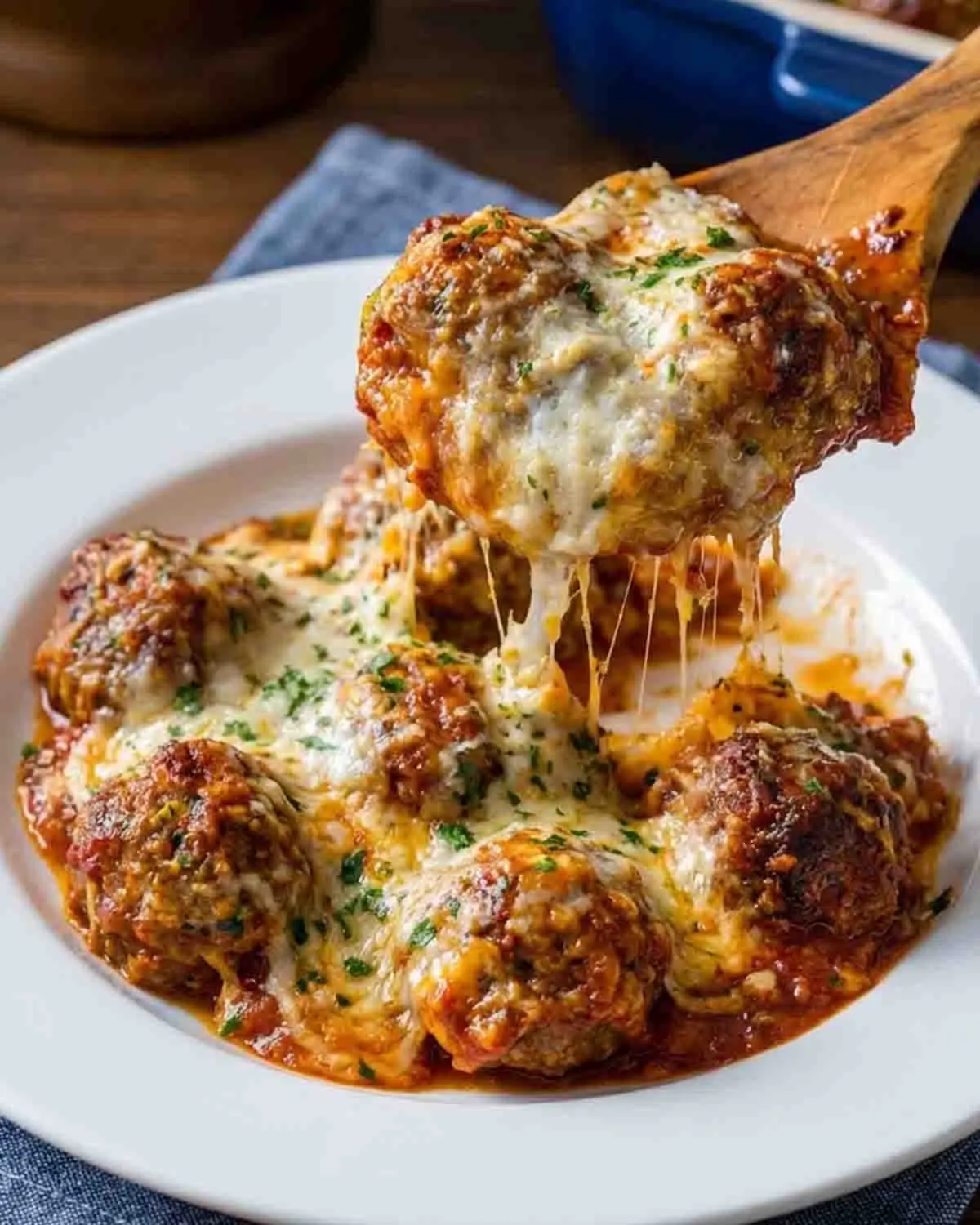 Meatball Parmesan Casserole Recipe 4 Meatball parmesan casserole served on a plate with melted mozzarella cheese and marinara sauce